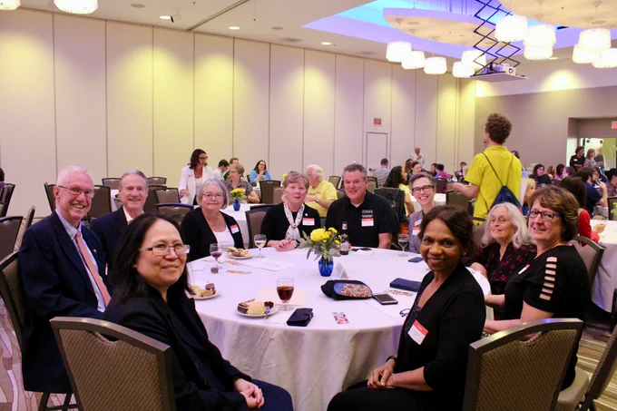 Our guests, including Professor and Dean Eunice Santos, sitting at a table during the 130th celebration of the iSchool at the iHotel.