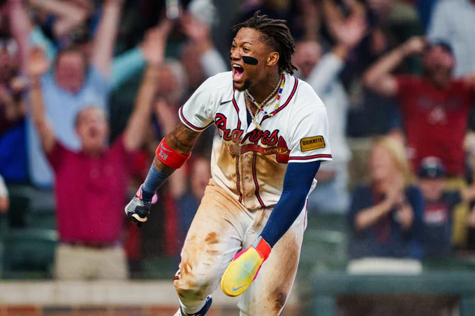 Ronald Acuña Jr. celebrates after scoring the winning run after a Braves walk-off victory earlier this season.
