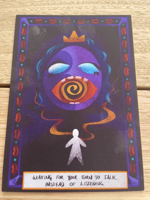 Tarot card from Mystiques that reads “Waiting for your turn to talk instead of listening”, which if I remember right means “I am a bad friend”