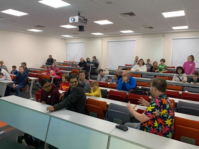 Attendees in lecture theatre with Kevin talking