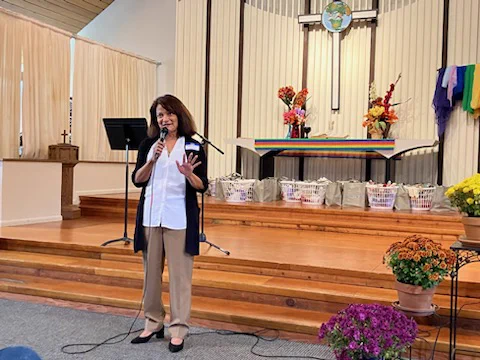 Commissioner Susheela Jayapal is speaking to an audience at the Portsmouth Union Church's celebration for the Portsmouth Commons