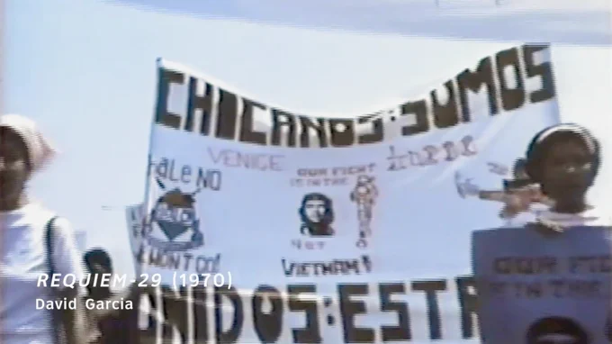 Scene from "Requiem-29" depicting a demonstration by Chicano people.