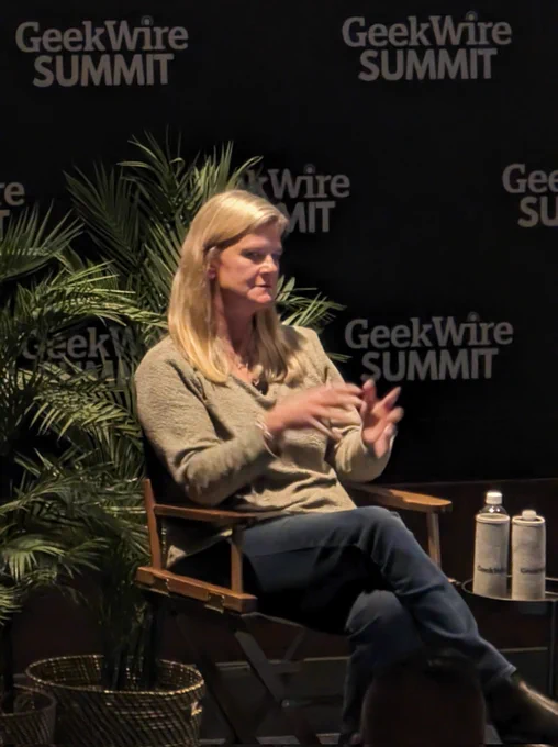 Photo of Charlotte Yarkoni (President, Commerce   Ecosystems, Cloud   AI at Microsoft) speaking onstage at GeekWire Summit on Seattle, WA 