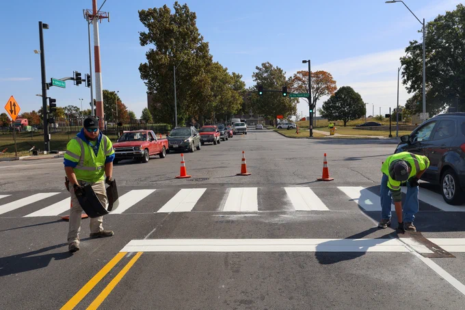 Photo by City of Kansas City, MO – Govt on October 19, 2023. May be an image of 2 people painting a road after resurfacing.