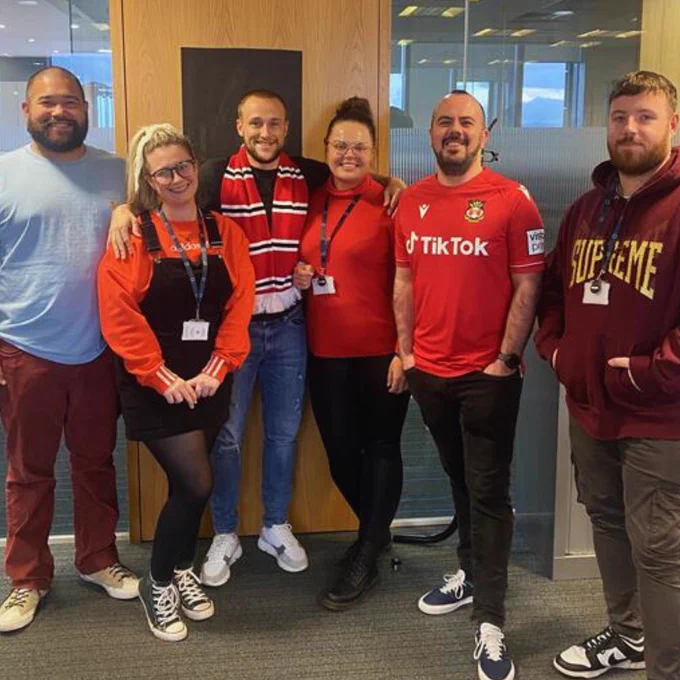 Colleagues wearing red for Wear Red Day 2023 - Show Racism the Red Card
