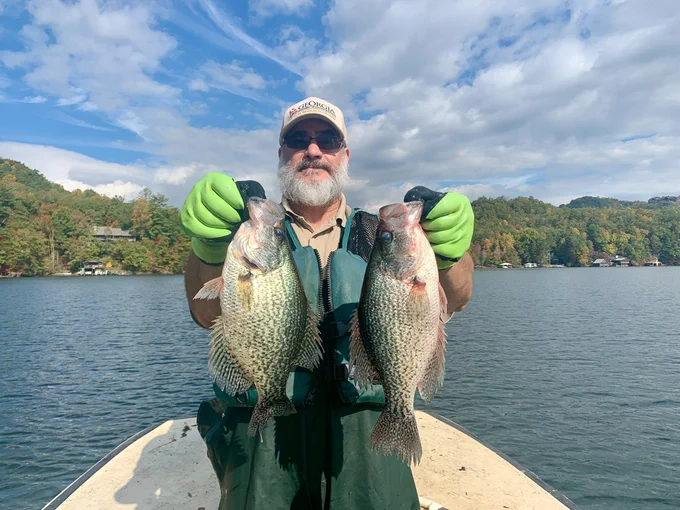Angler with two crappies caught on Lake Burton. 