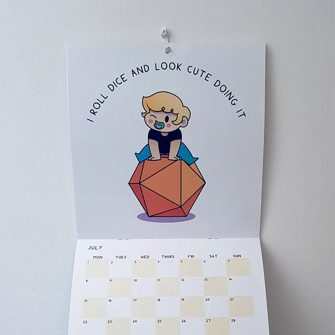 Image of the Dungeon Delves calendar open to the month of July.

"I roll dice and look cute doing it." Image of Dungeon (they/she) sitting on a giant orange 20 sided die, winking in a cute pose.