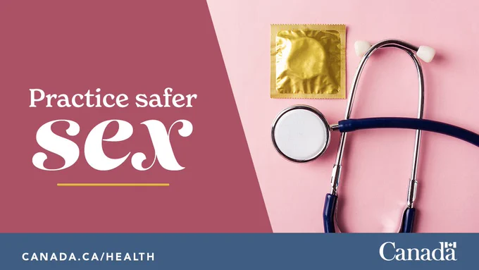 A condom in a gold wrapper and a stethoscope over a pink background. The following words are printed on the image. Practice safer sex.