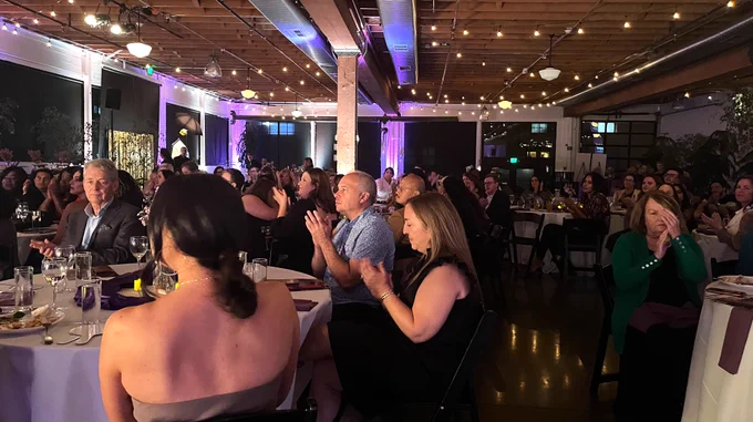 Many guests seated at dinner tables at the Bradley Angle GlamHy Award