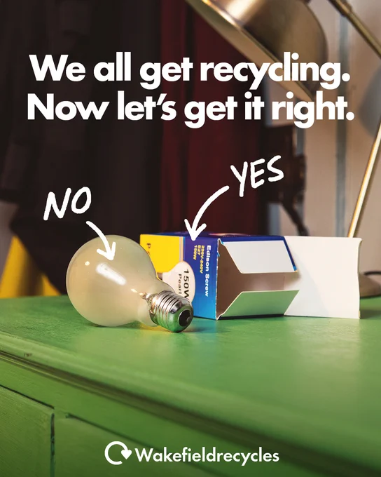A green cupboard with a light bulb and an empty light bulb box. It has the words we all get recycling, now let’s get it right, with the word no and an arrow pointing to the bulb and the word yes with an arrow pointing to the box. 