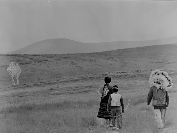 Members of the Gabrielino-Tongva Indian Tribe are shown in 1963 hiking past a marker at the hub of the original 1,000-acre Irvine Co. donation to UC Regents. 