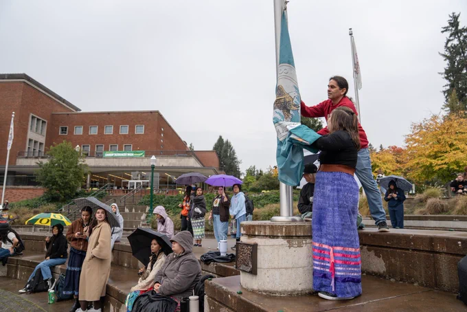Students celebrating Indigenous Peoples Day at the University of Oregon during the tribal flag ceremony.