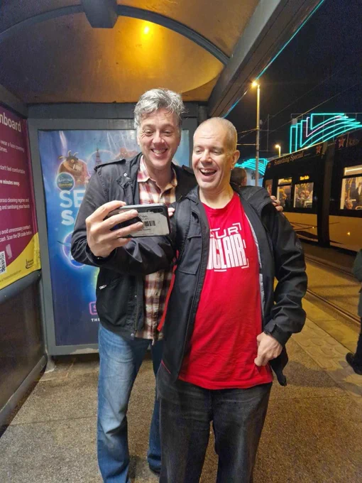 Pete Prodge with Iain Lee at Central Pier tram stop in Blackpool