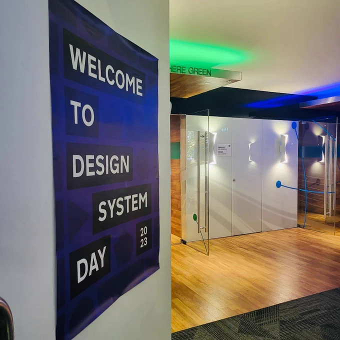 'Welcome to Design System Day 2023' stand up banner at the venue.