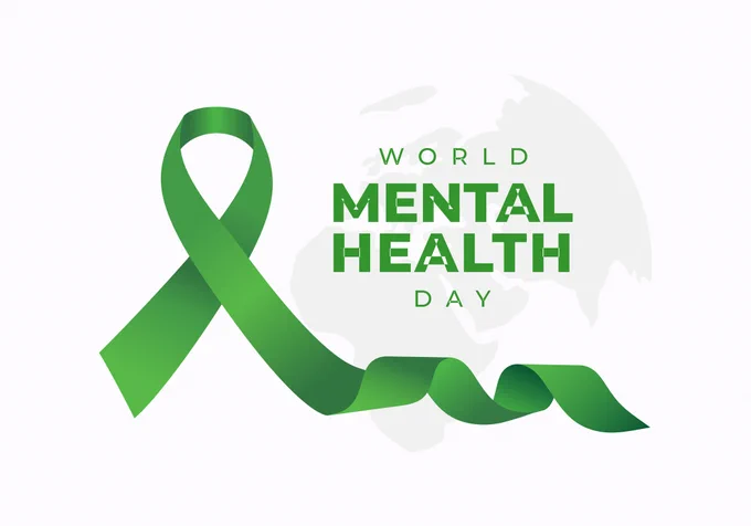 Text saying 'World Mental Health Day'  along with a green ribbon