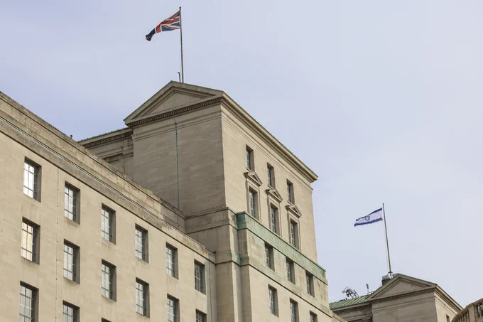 The Israeli flag flies from the Ministry of Defence alongside the Union Flag