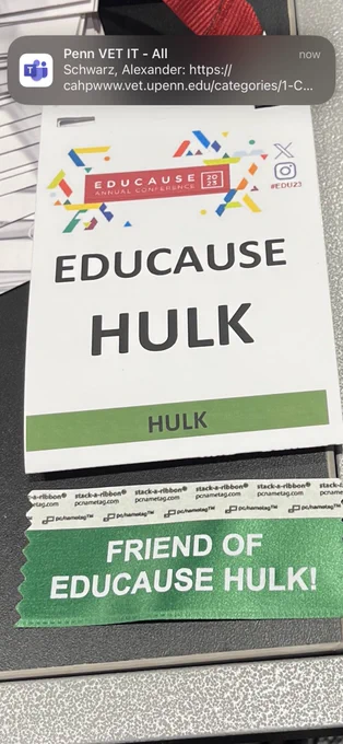 Conference badge with the words “EDUCAUSE HULK” written on it. With a green and white FRIEND OF EDUCAUSE HULK ribbon.