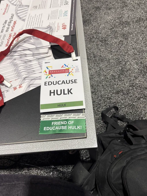 Conference badge with the words “EDUCAUSE HULK” written on it. With a green and white FRIEND OF EDUCAUSE HULK ribbon.