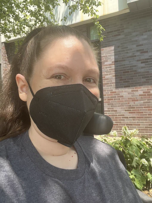 Myself sitting outside wearing a kn95 mask
