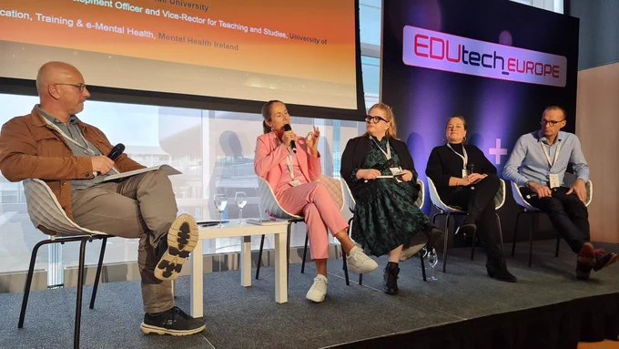 Lukáš Krump, Beatrix Busse, Sonia Rennick, Valéry Oude Groen, and Mark Simpson on stage discussing mental health and well-being for an improved learning experience.