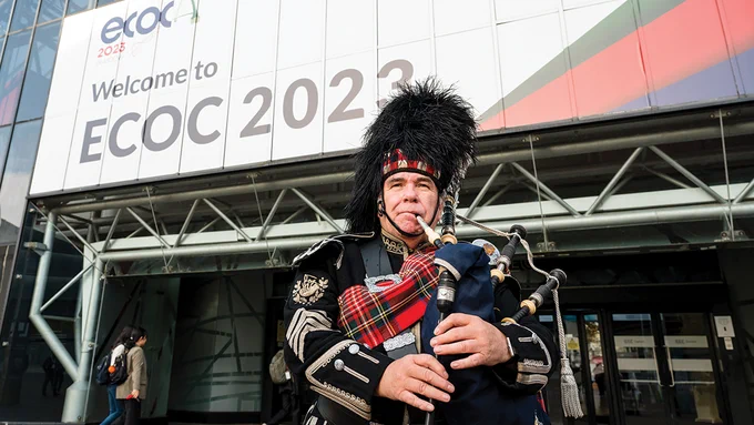 Pipe Major Stuart McKenzie entertains delegates arriving at ECOC 2023