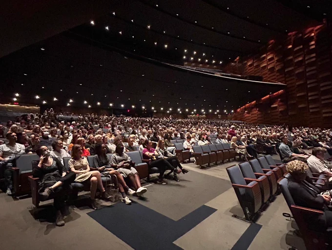 Wide shot of audience sitting in Meridian Hall theatre in Toronto waiting for the Fall for Dance North’s programme.
