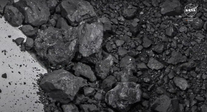 Material from Bennu inside the sample canister. Credit: NASA