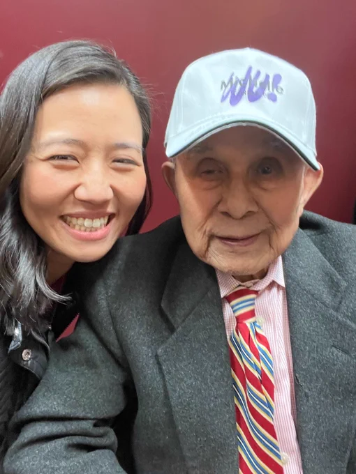 Mayor Wu takes a selfie with Frank Chin; they both smile.
