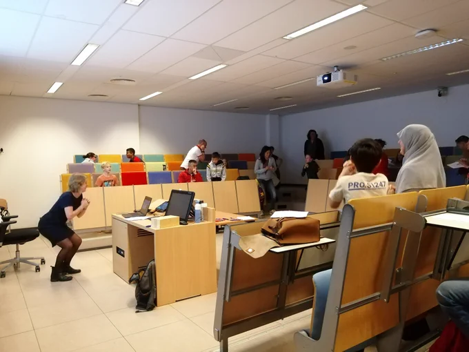Me and the children and their parents doing squats in a lecture room