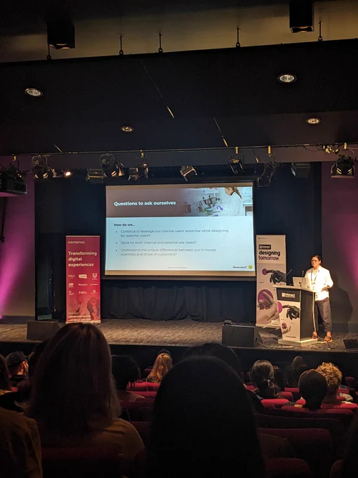 April on stage at Interact London. Content on screen given in tweet 