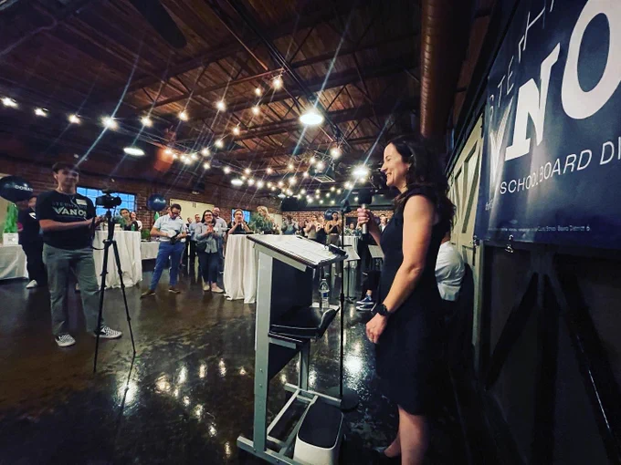 [ID: These are photos from a kick off event, including one of Stephanie speaking, one selfie, and several group photos]