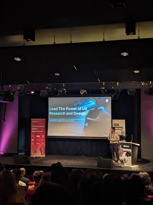 Doron on stage at Interact London. Talk title provided in tweet 