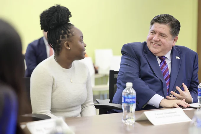 Governor Pritzker listens as a student speaks during the roundtable discussion.