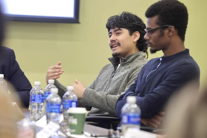 A student speaks during the roundtable discussion.