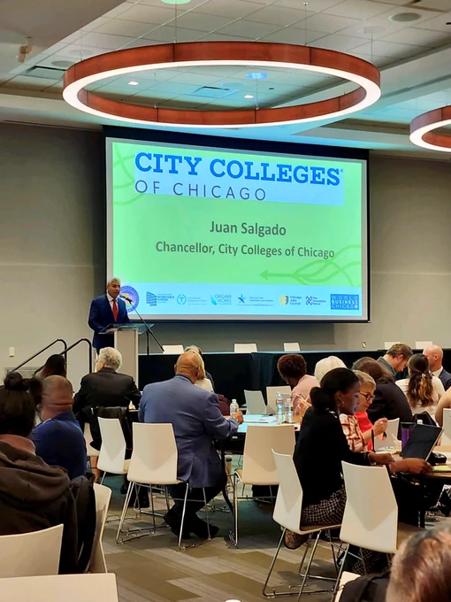 Juan Salgado delivers remarks from a podium.