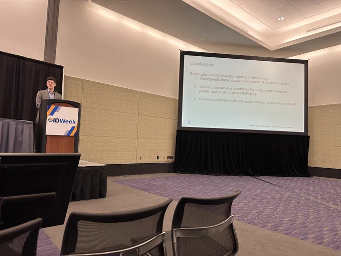 Dr. Ethan Borre presenting at ID Week. Image includes presentation's conclusion slide, which reads: "Reallocation of HIV prevention funding in Tennessee (1) would greatly harm people at risk for acquiring HIV; (2) would confer minimal benefits for first-responders, pregnant people and survivors of sex trafficking; and (3) cannot be justified on clinical, epidemiologic, or economic grounds."