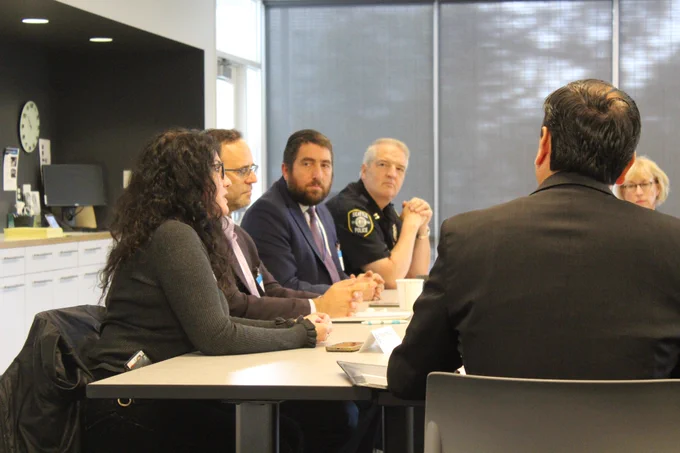 A woman speaks at the roundtable discussion with Mayor Harrell.