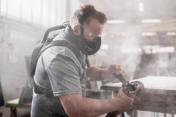 Stone cutter wearing the optrel Swiss Air