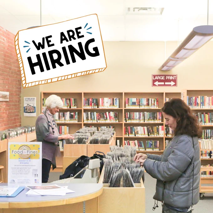 Two women browse a DVD collection at a public library. Text reads, "We are hiring."