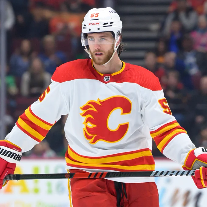 Noah Hanifin in a white Flames jersey