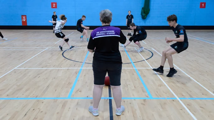 General view of a game of dodgeball being played.