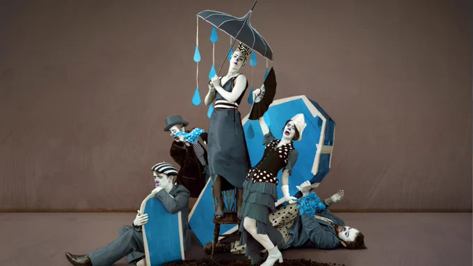The poster image for Good Grief by Ugly Bucket: five clowns in black, brown, and blue in various poses under a raining umbrella