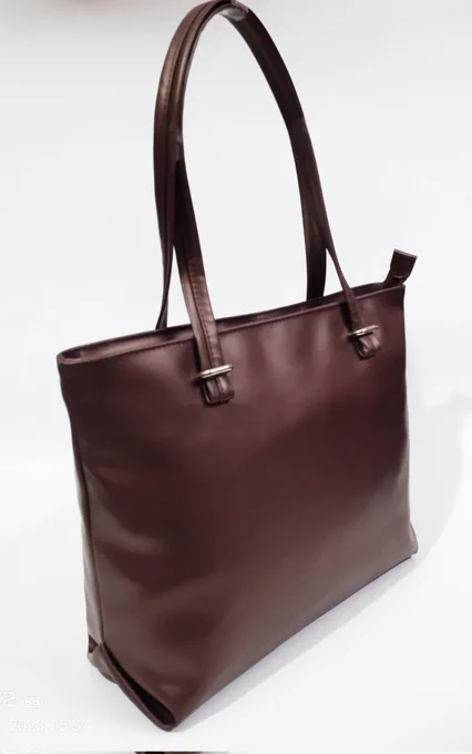 Eliza ladies purse, color brown made from premium quality Pu-leather  good quality bags main compartment open with zipper one pocket at back bag look is classic for ages inner has two pockets, one sleep one  zipper pocket you can use any where. #lucy #ladiespurse #wedding #babygirl #sisters#OldAge #party #shoppingbag 