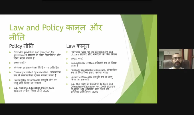 Screenshot of zoom meeting with a PPT slide showing the differences between policy and law. We can see the moderated Vineet to the right of the screen.