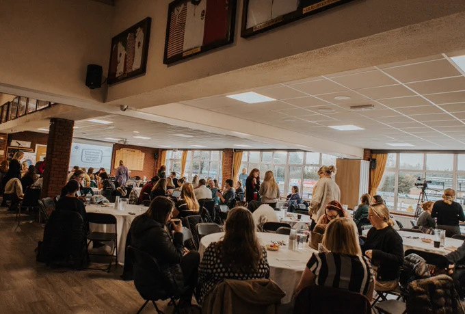 Staff sat down at an event at Preston Grasshoppers