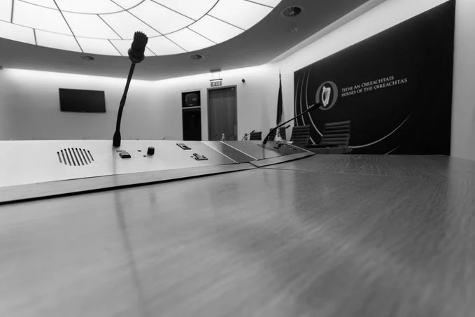 black and white photo of a committee room in Leinster House 