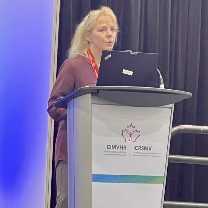 Suzette Brémeault-Philips speaks at a podium.