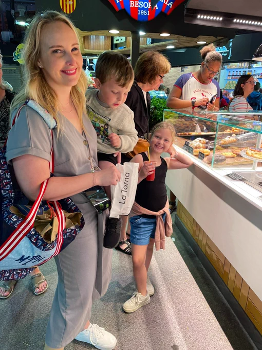Mandy and the kids in the outdoor market.