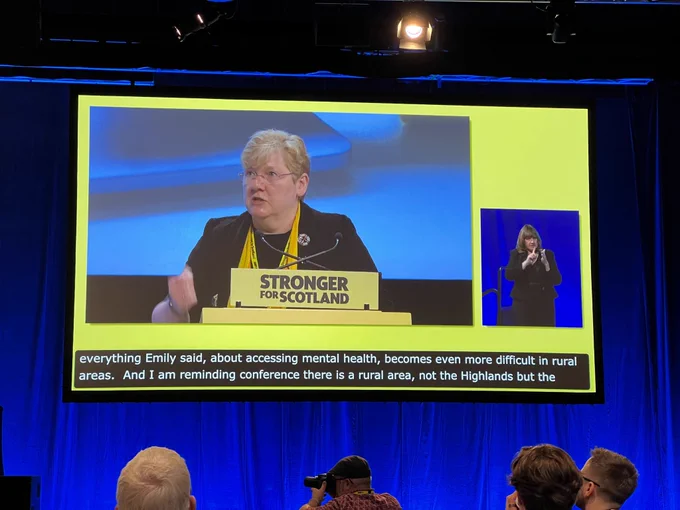 SNP Students' Equalities Officer Kim Marshall speaking on the stage at SNP Confrence 2023