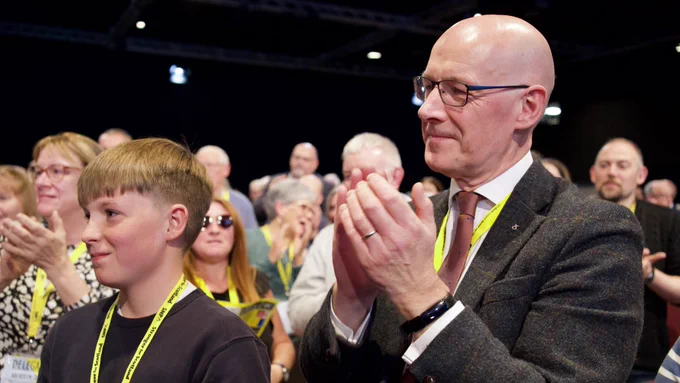 John Swinney MSP at the SNP Conference in Aberdeen with his son.